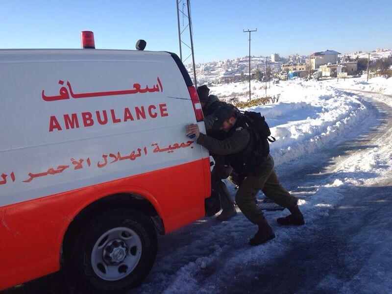 idf-soldiers-helping-palestinian-ambulance-snow-gaza