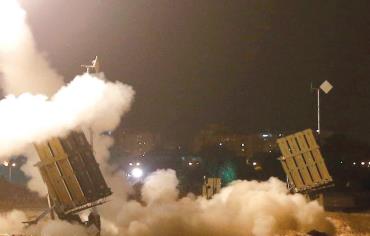 An Iron Dome launcher fires an interceptor rocket in the southern port city of Ashdod, July 8 Photo: REUTERS/BAZ RATNER