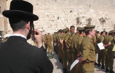 Haredi man overlooking IDF ceremony - Photo: Marc Israel Sellem